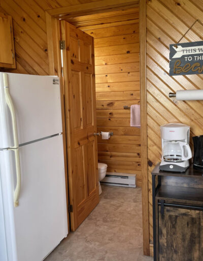 The Cottage at Nautical Retreats in Bayfield, Nova Scotia - Kitchen Area going to the Bathroom